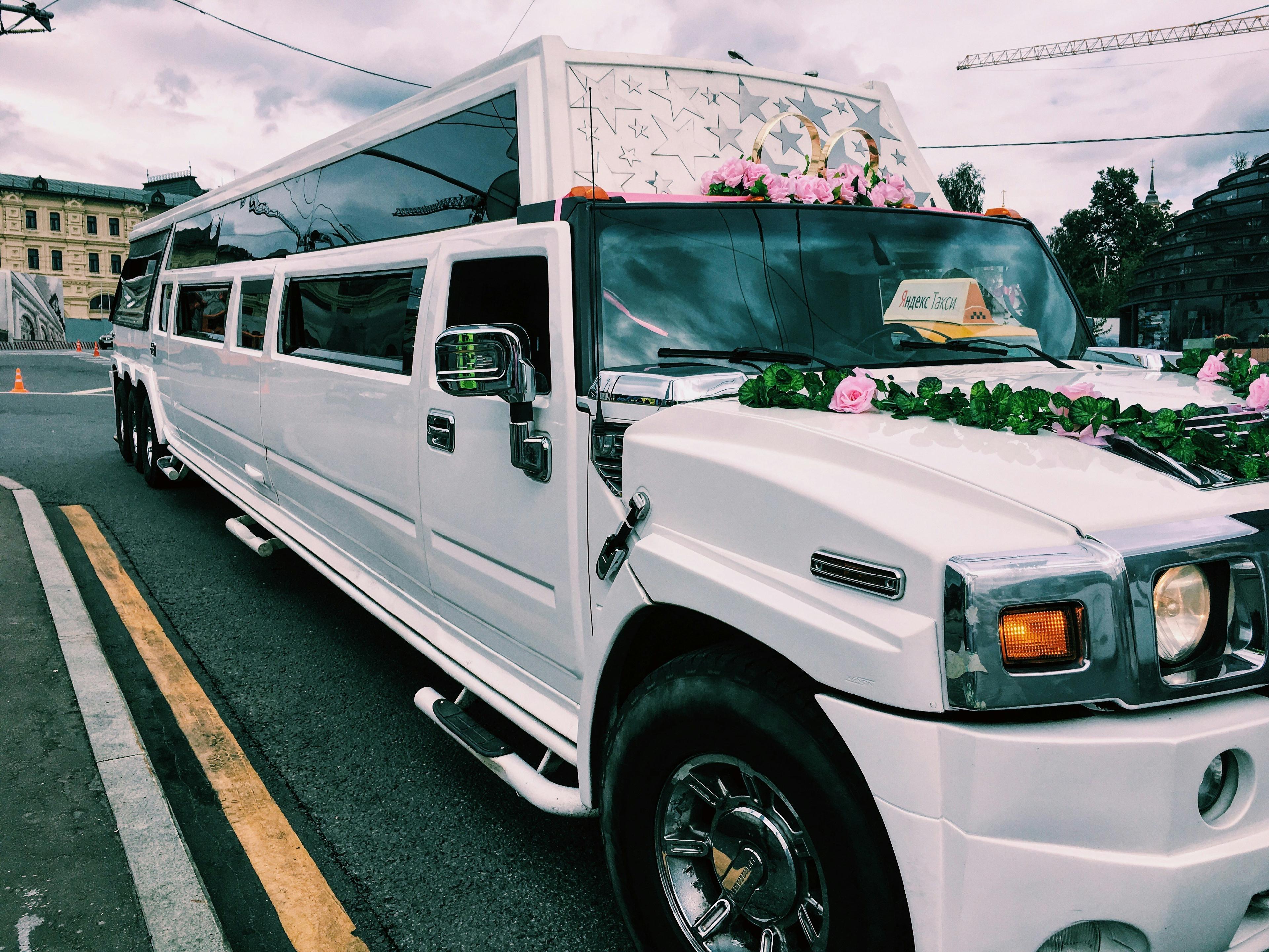 White stretch limousine decorated with flowers parked outside a Las Vegas wedding chapel