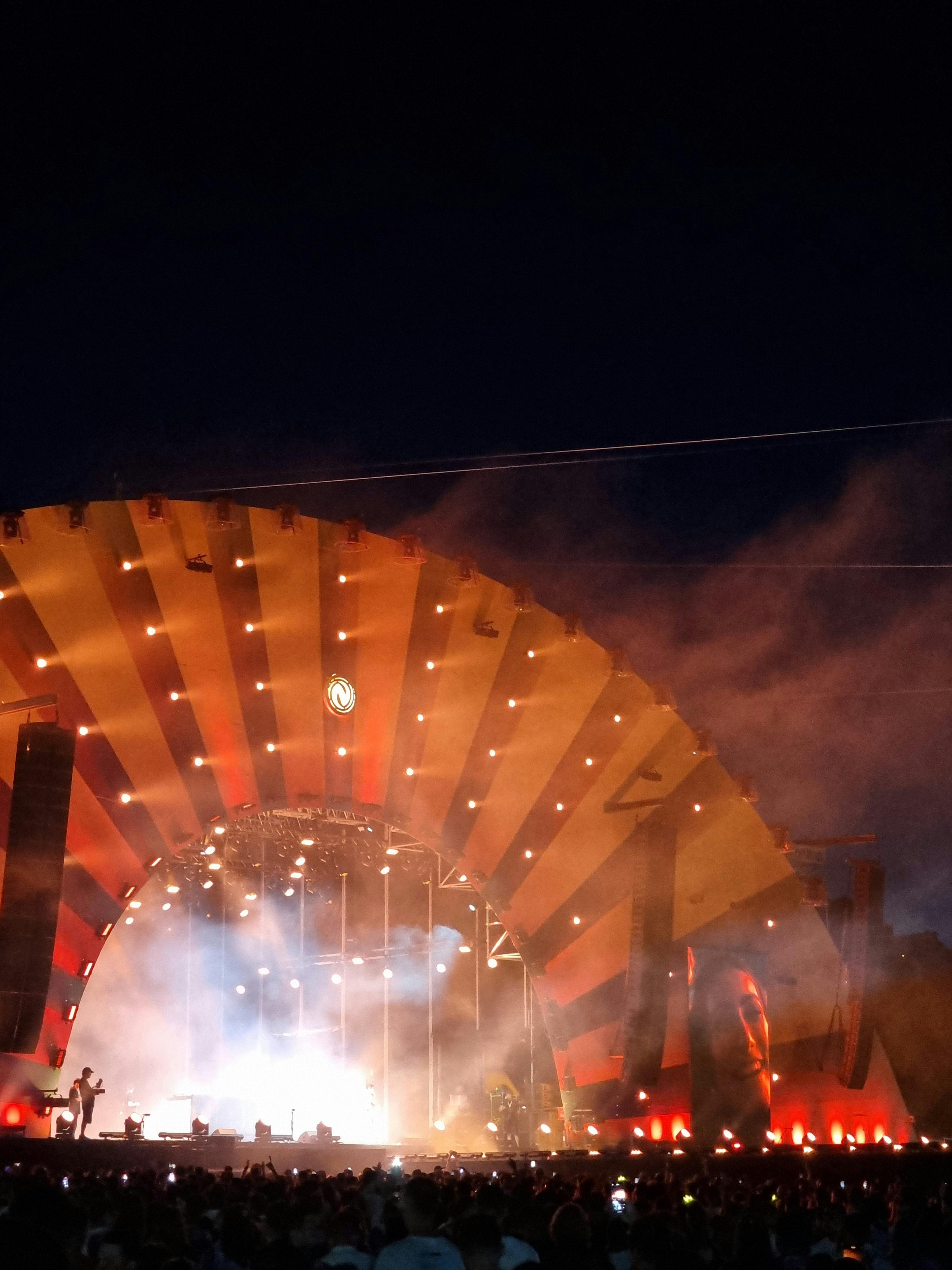 Concert venue in Las Vegas with stage lights and a large crowd enjoying a live performance