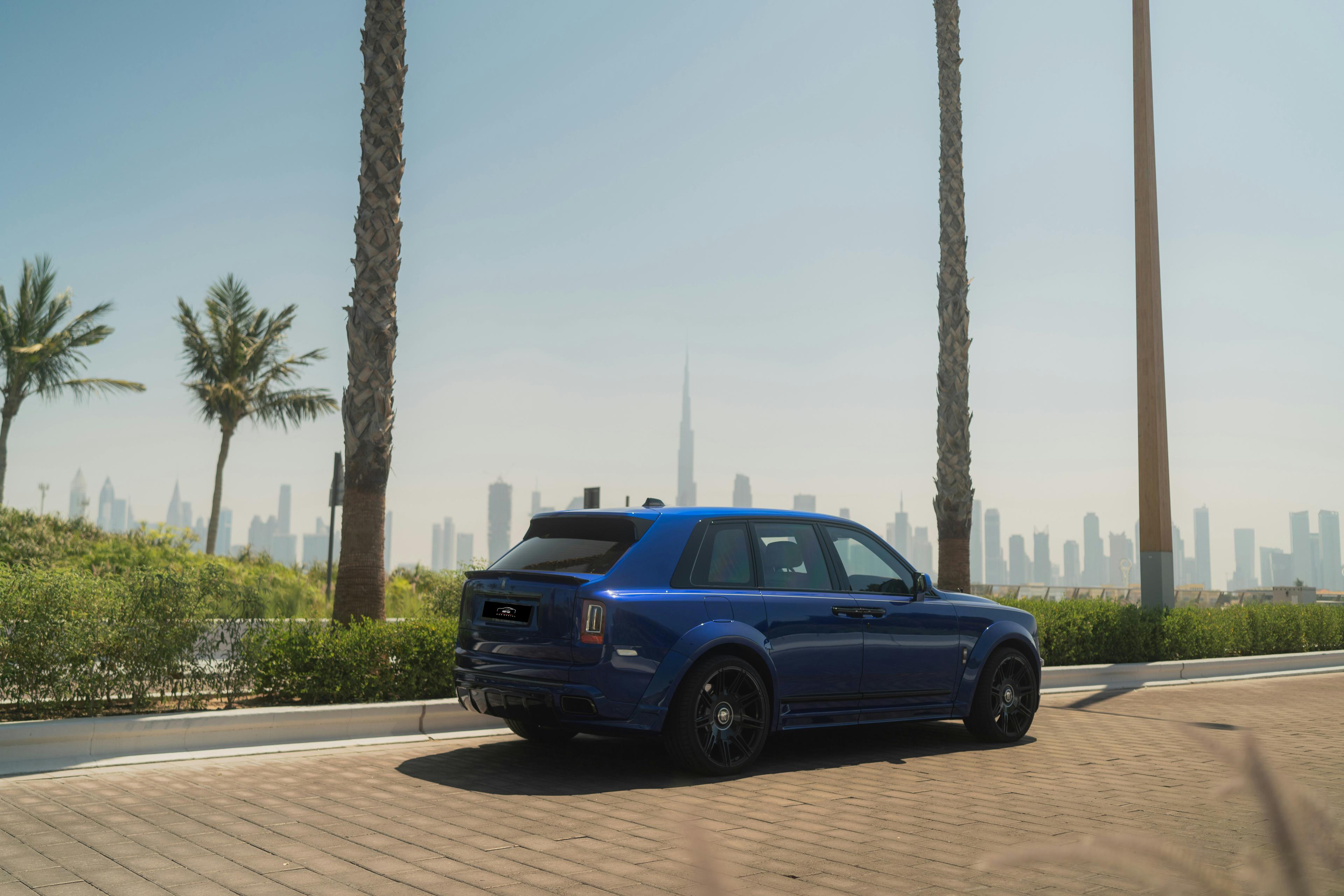 Futuristic luxury vehicle booking interface on a smartphone with Las Vegas skyline in the background